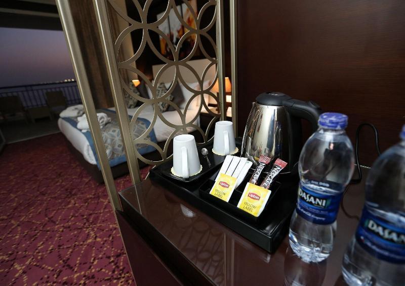 Tolip El Forsan Hotel Ismailia Bagian luar foto Bottled water in a hotel room